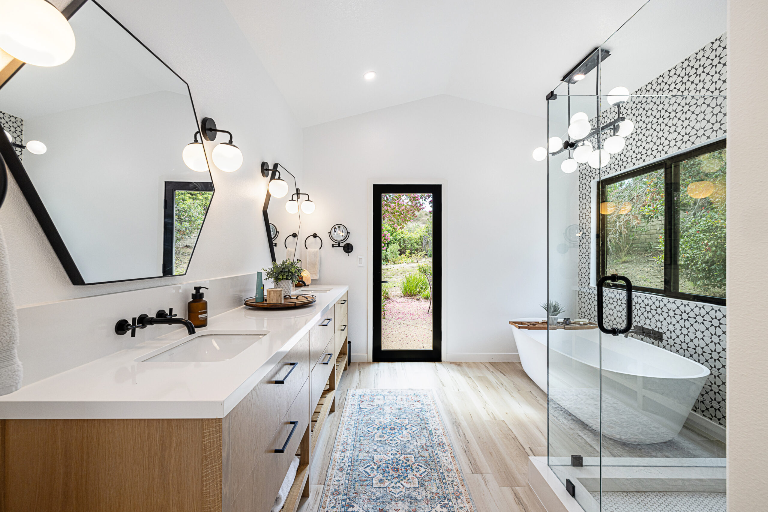 Luxurious bathroom remodel with soaking tub and marble finishes